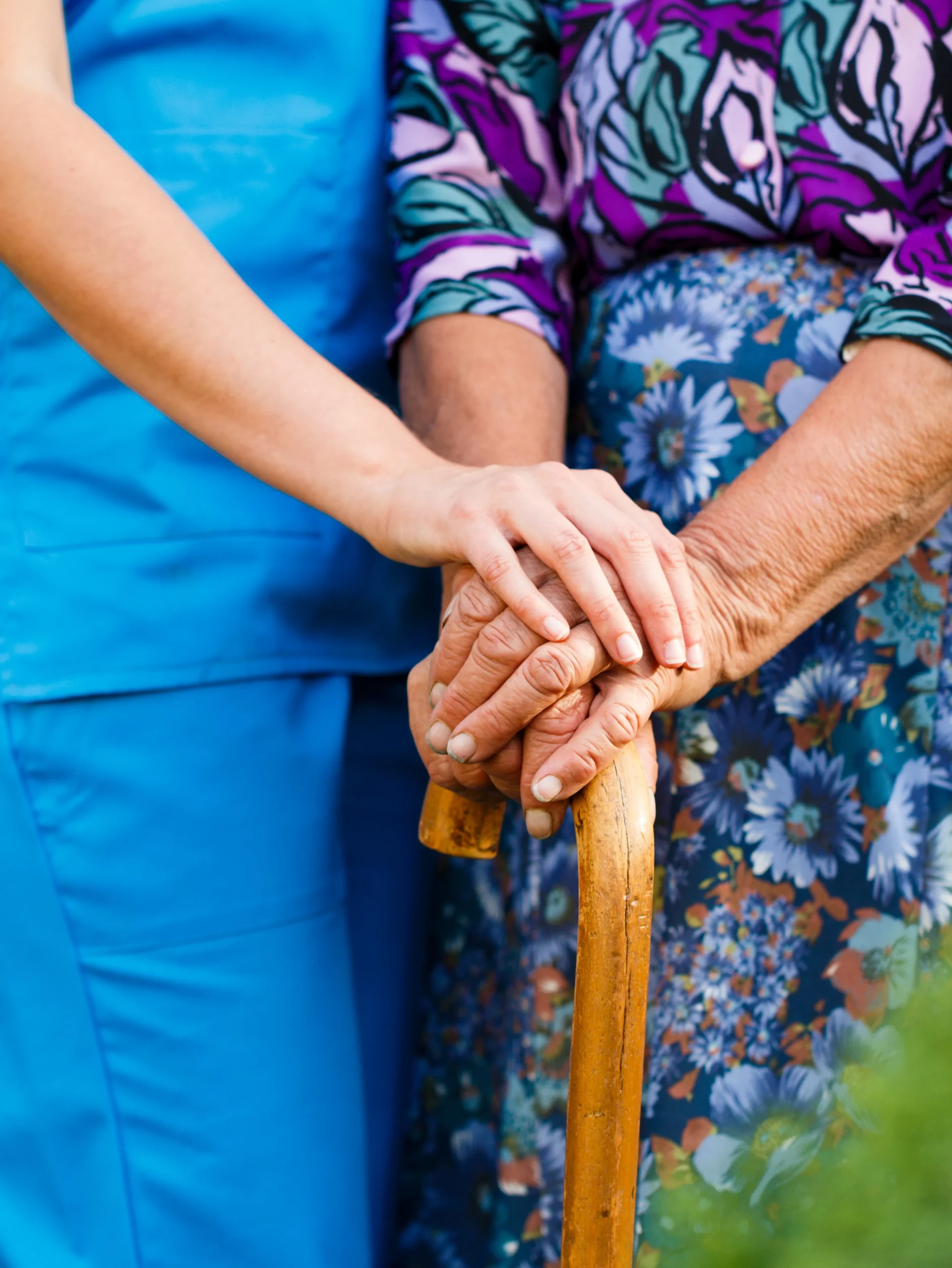 Supporting the elderly with Parkinson's disease - concept.